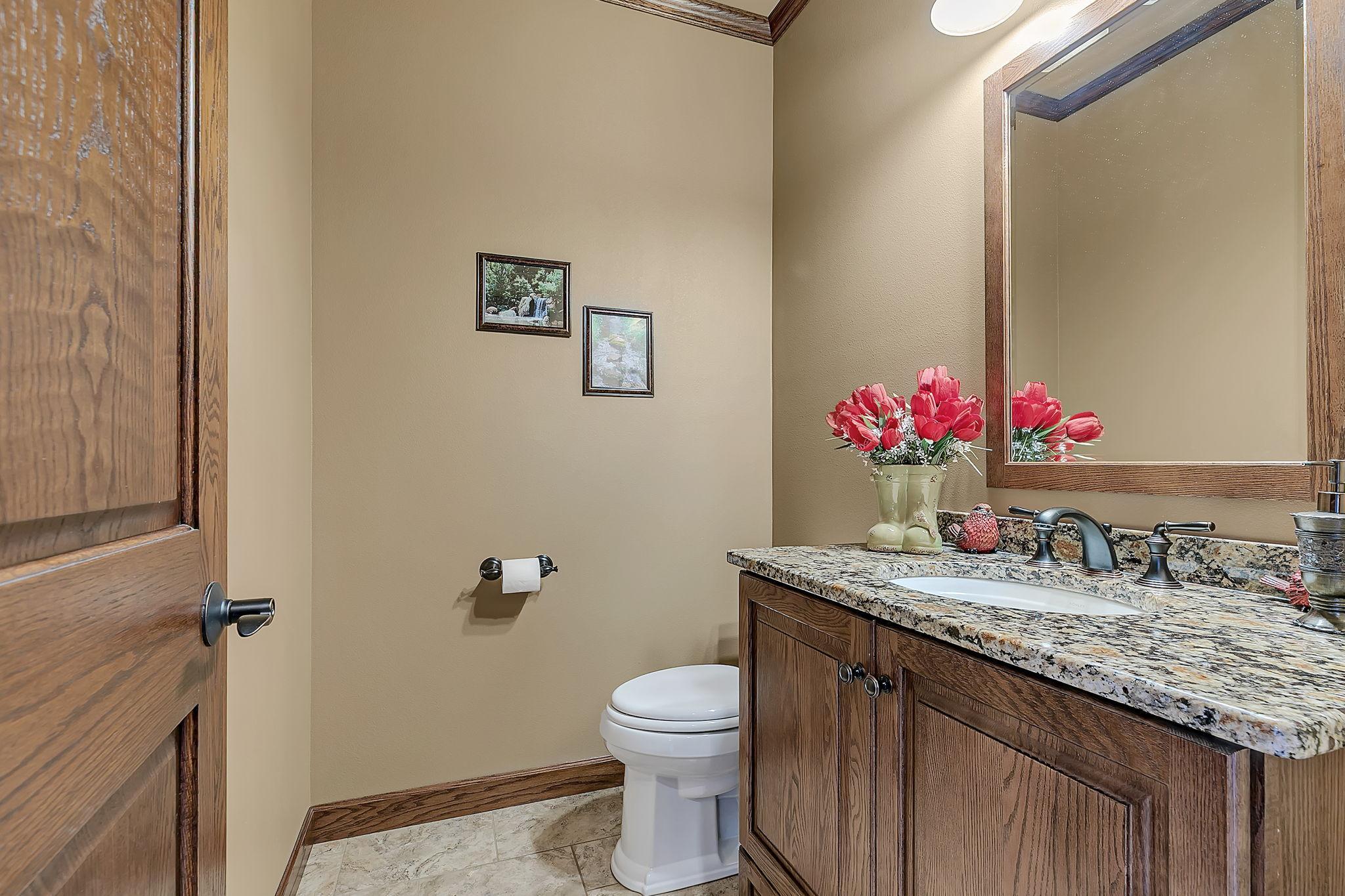 Main level powder room in mudroom area