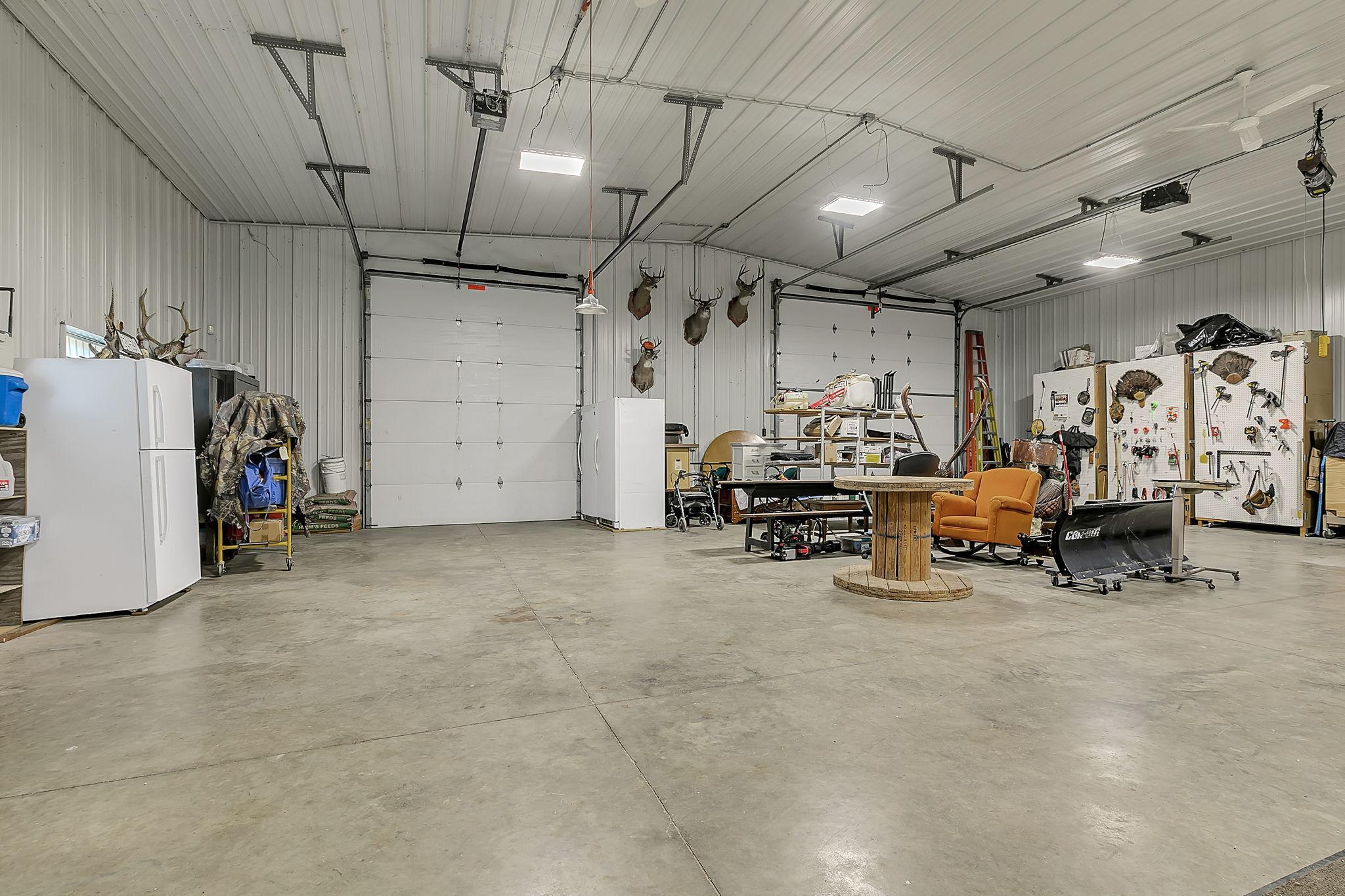 Shed features 15' ceilings w/ 14'x14' and 10'x12' overhead doors