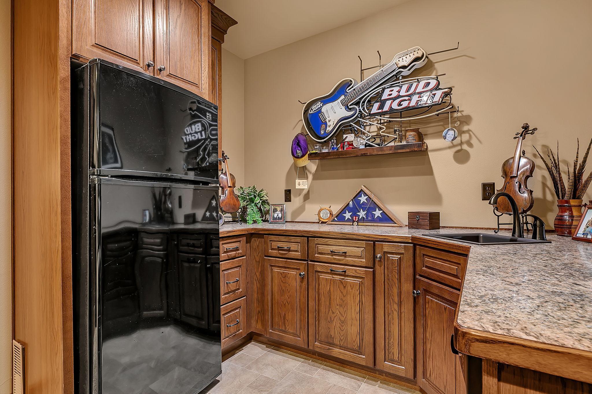 Wet bar within the family room space for entertaining