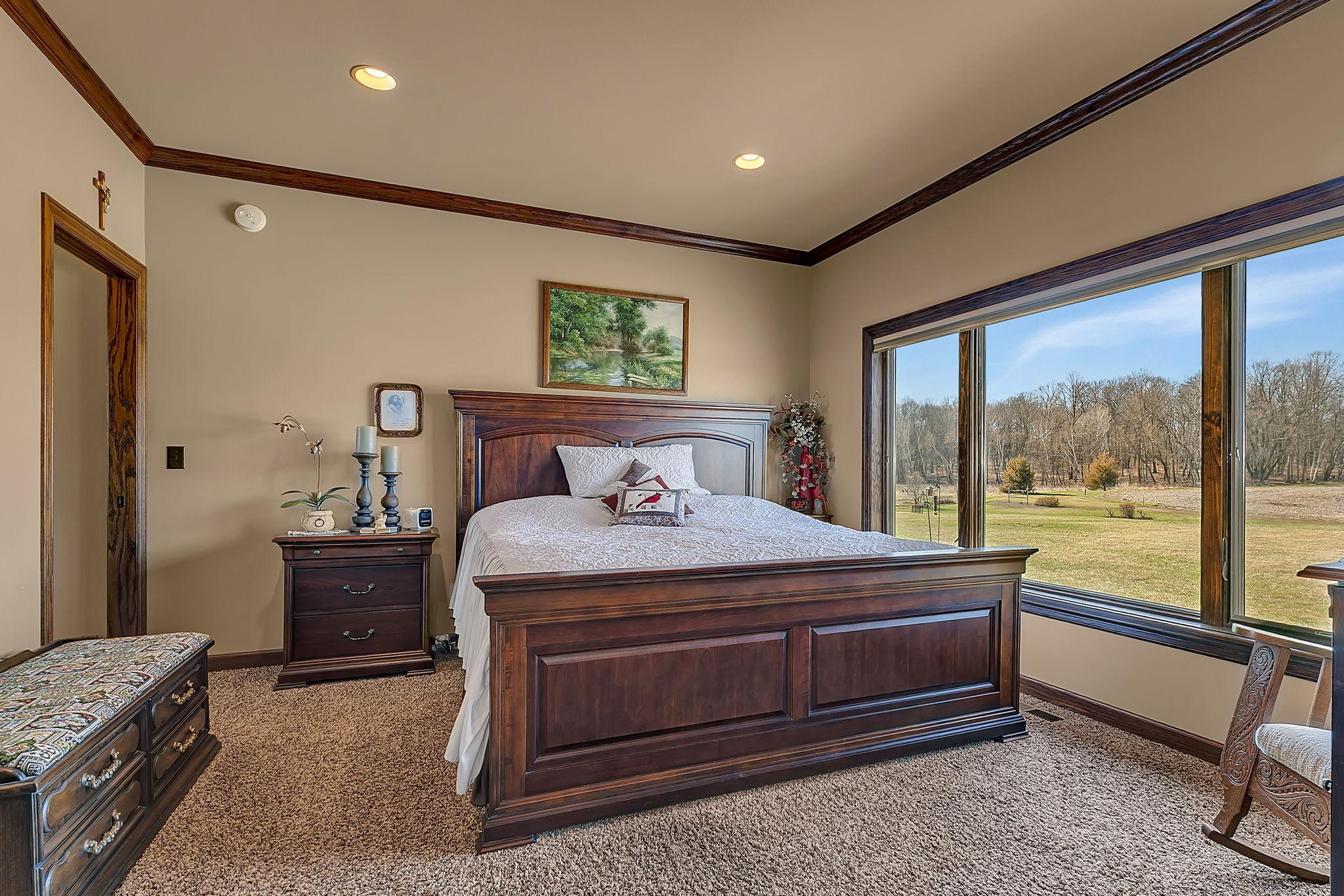 Main level primary bedroom suite with cove molding