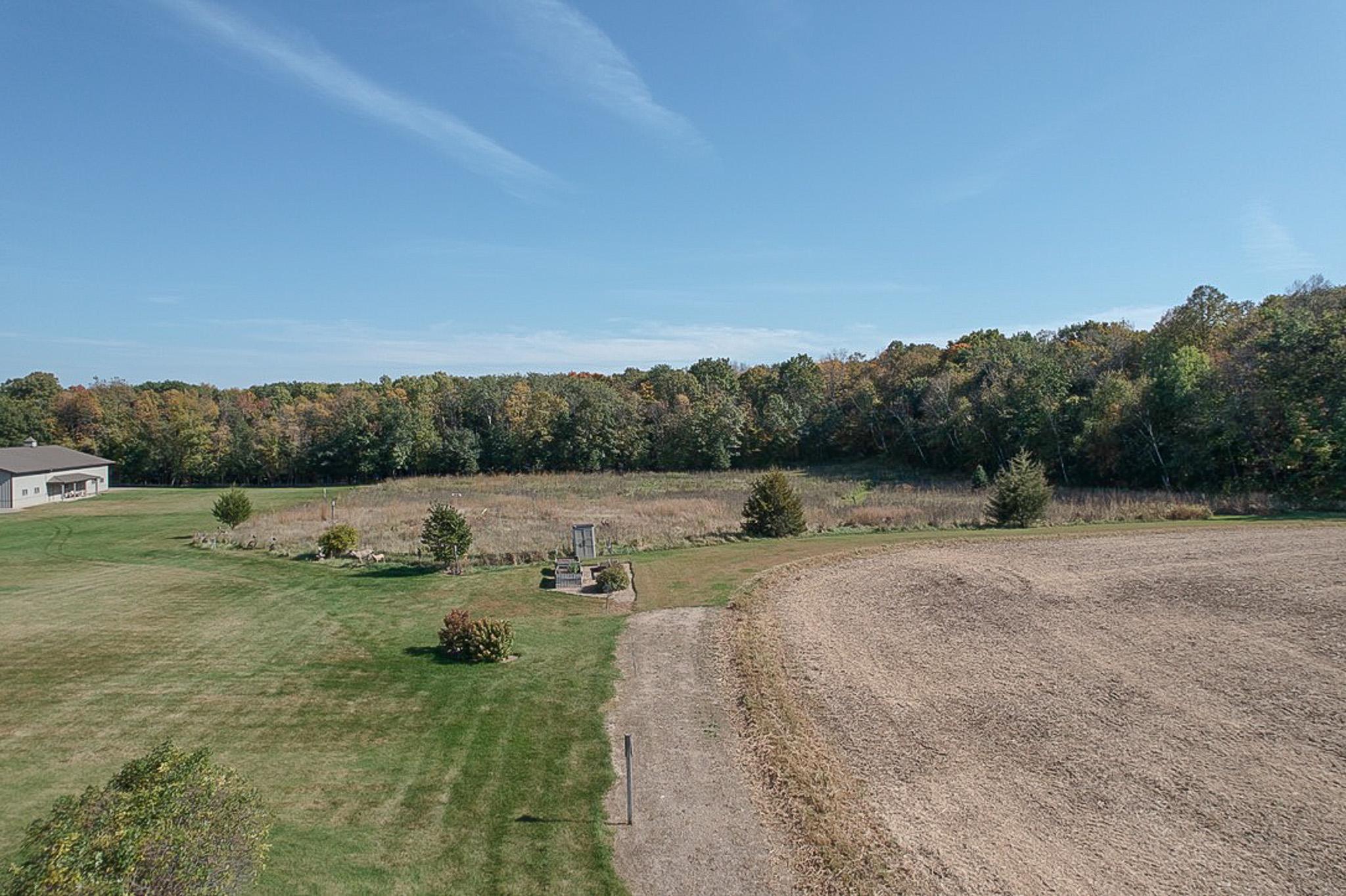 Property features approximately 11 acres of prairie CRP and 10 acres of tillable land plus an abundance of wooded acres.