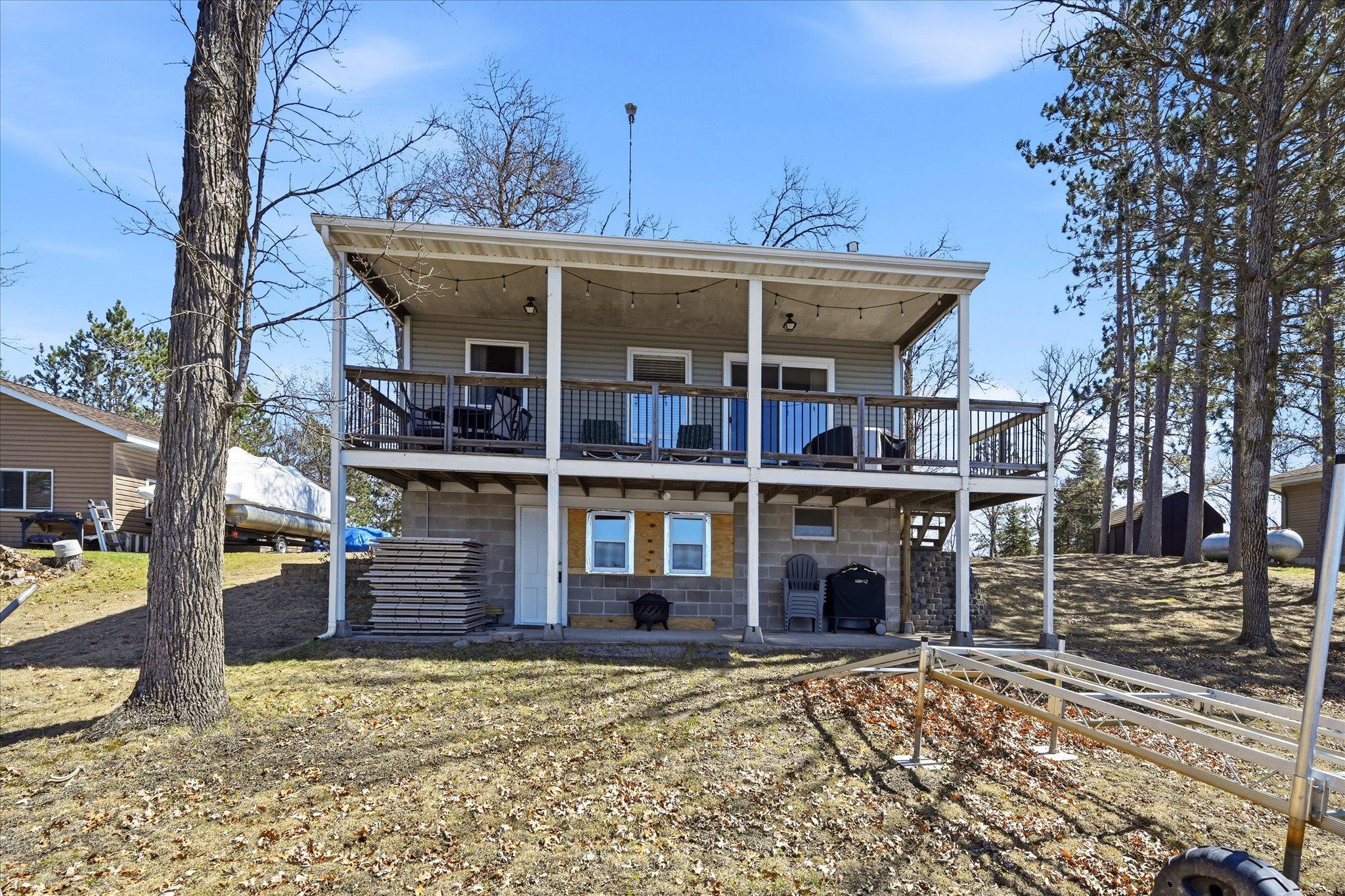 Wonderfully situated to entertain on the enormous deck and patio. Notice the newly installed windows on the lower level.