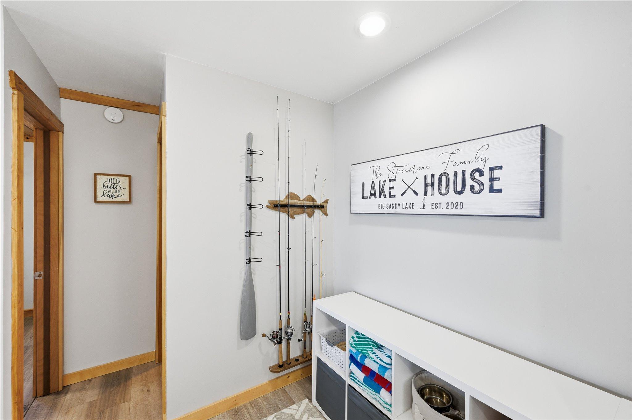 Flex area for lake gear or perhaps make into small office/bar area, game space...