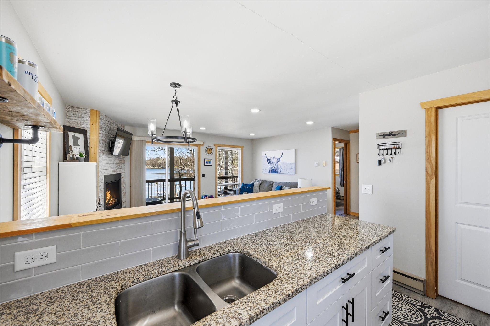 Lovely glass tile backsplash.
