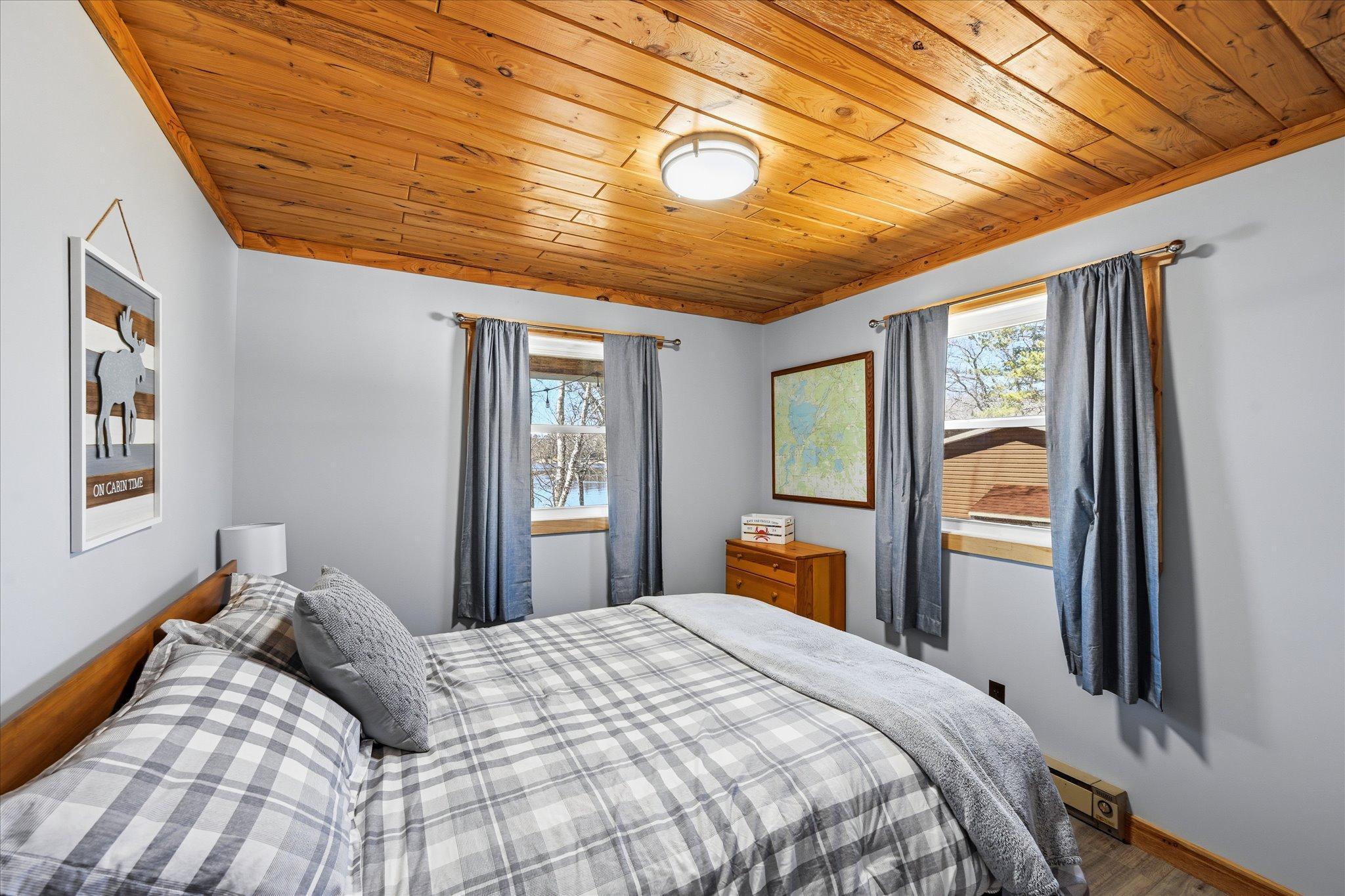 Lakeside primary bedroom. New tongue and groove ceiling
