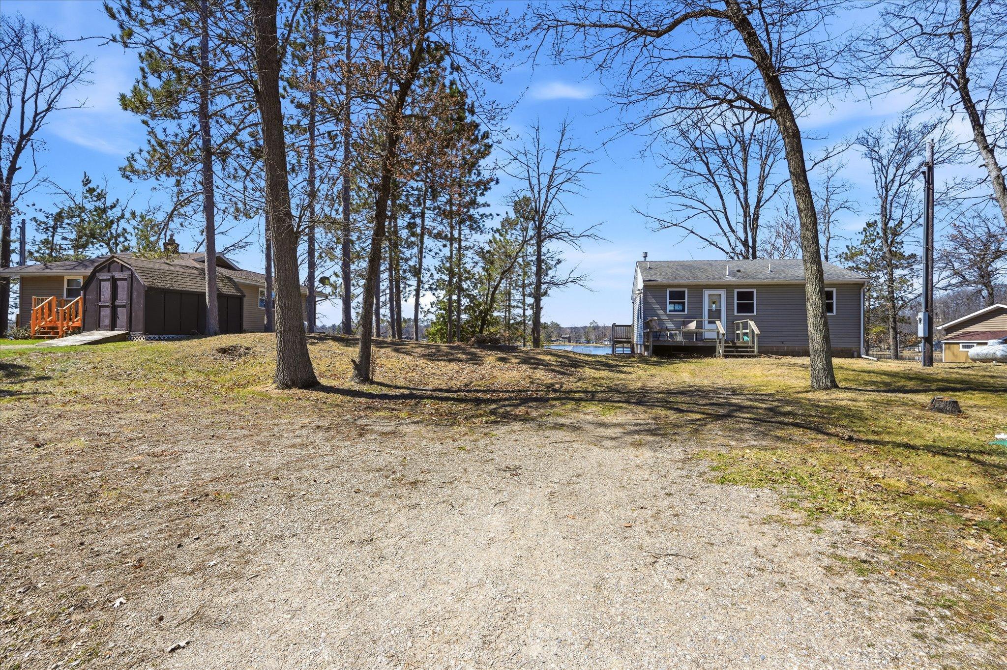 Large gravel parking area.