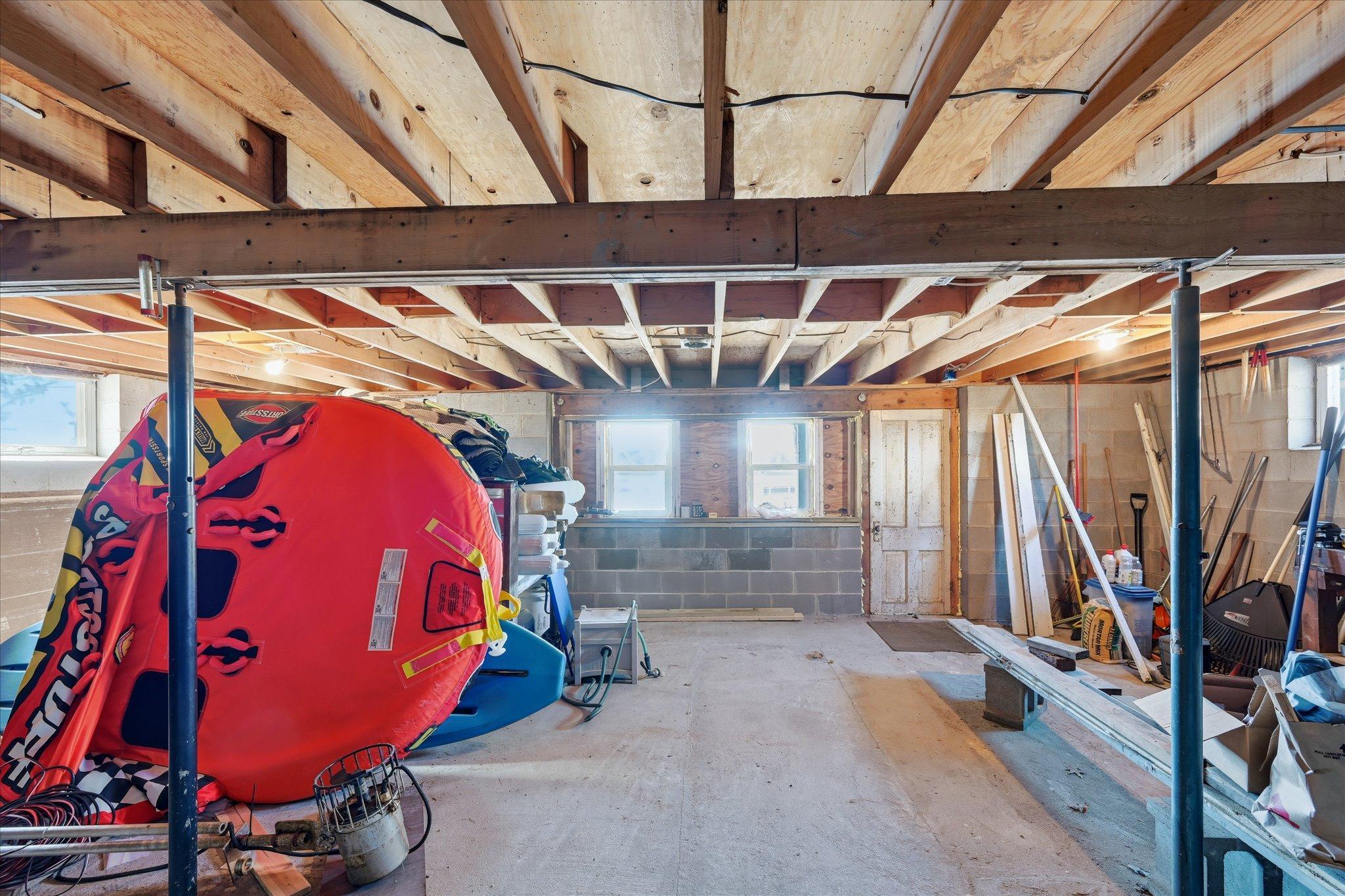 Replaced the garage door added windows and door to finish lower level. Access is from outside.