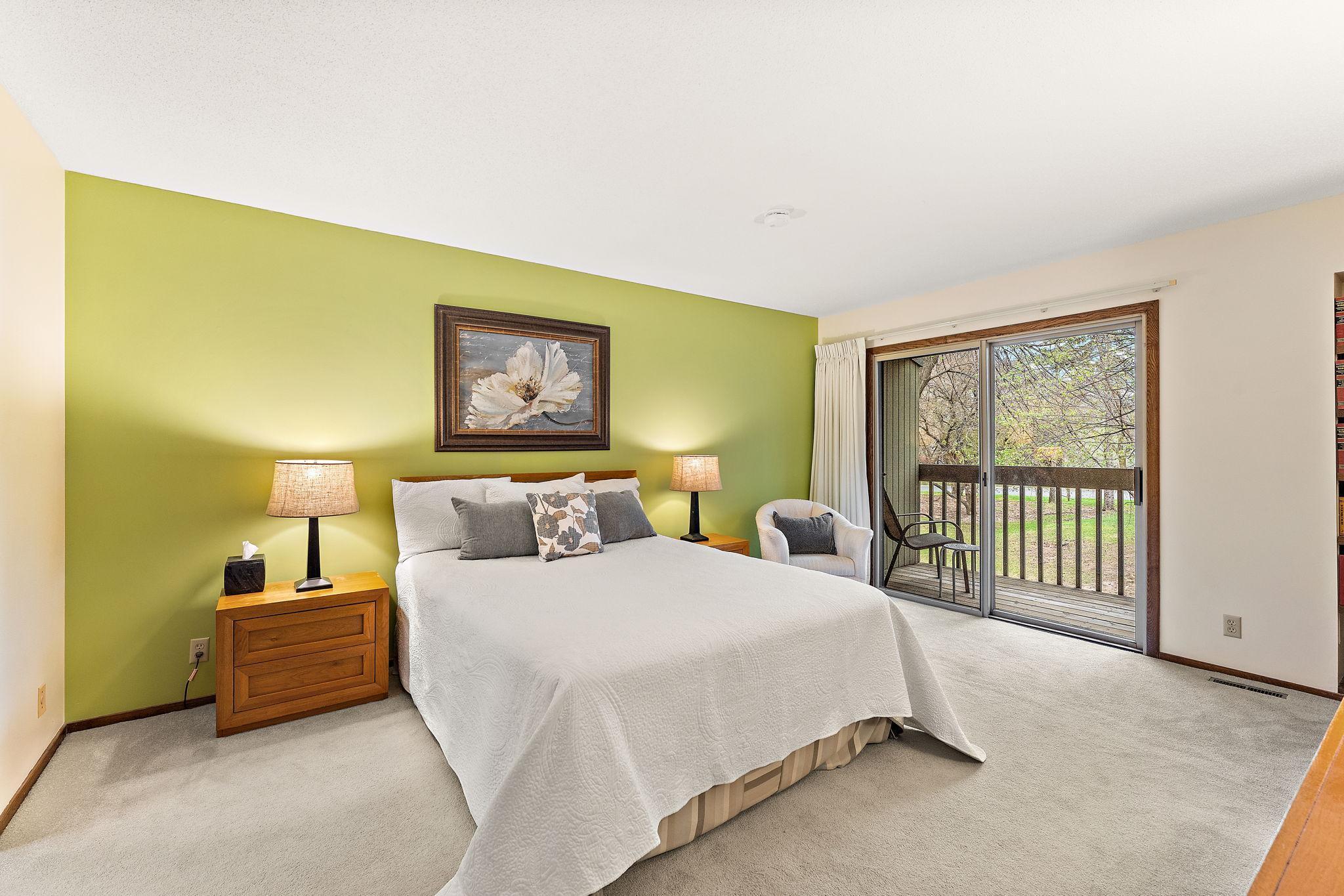 Primary bedroom with balcony