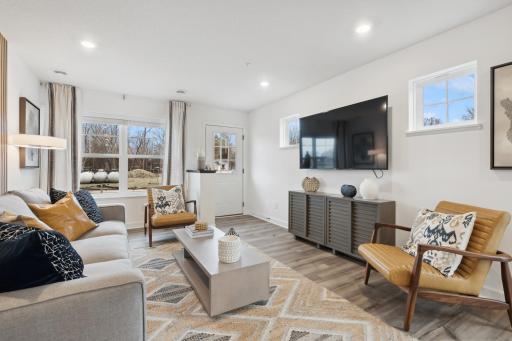 (Photo of decorated model, actual home's finishes vary) Feel at home in this spacious and open family room.