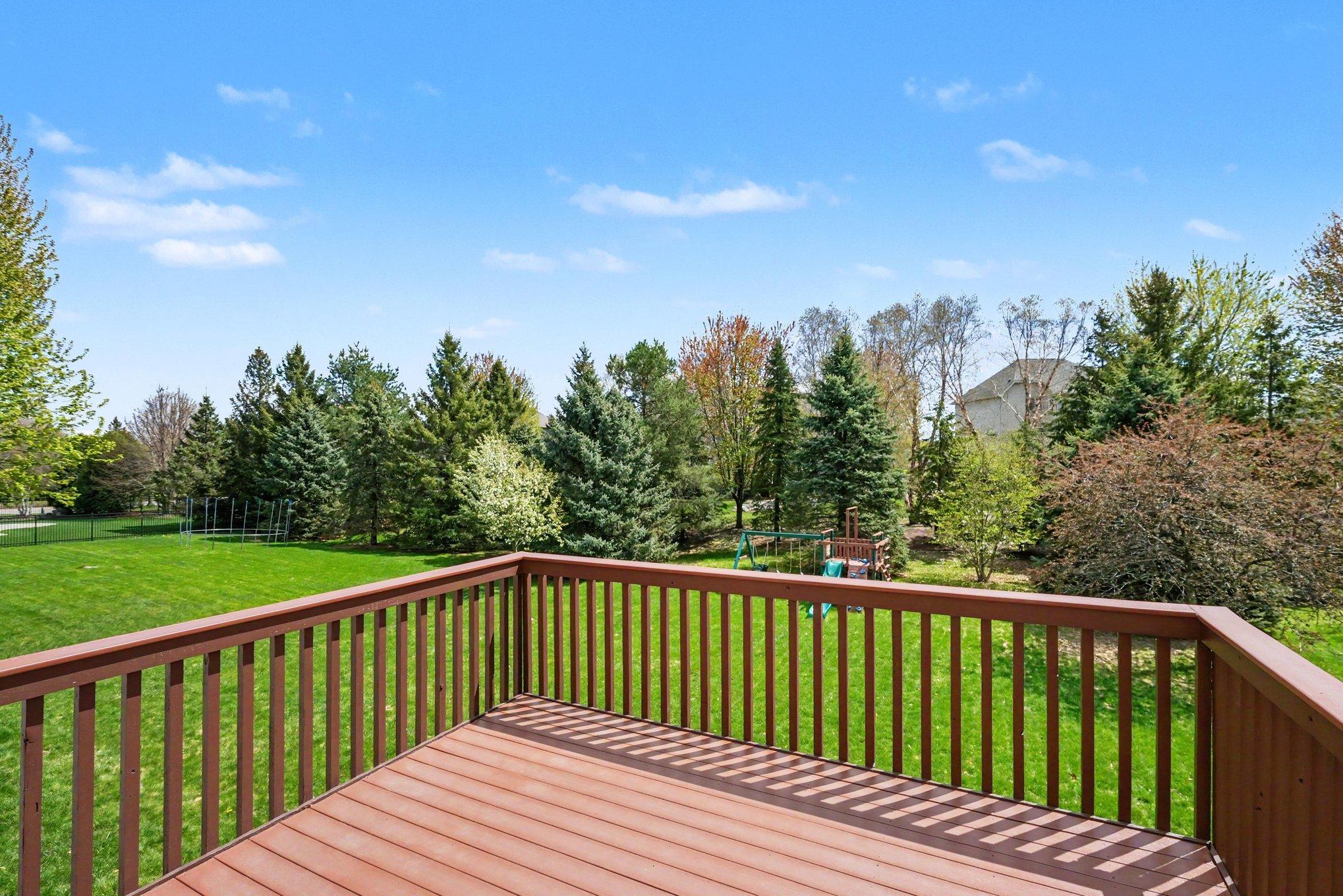 Deck overlooking the spacious backyard