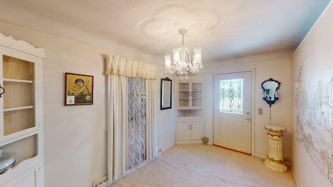 Formal dining room w/built-in corner hutch