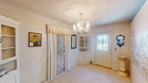 Formal dining room w/built-in corner hutch
