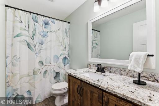 Refresh and unwind in a bright upper-level bath featuring a granite vanity, full tub and shower, and modern finishes. Start and end your day in a clean, comfortable space designed for everyday ease.