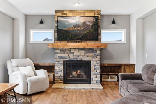 Gather around the beautiful stone fireplace and enjoy cozy evenings by the fire. Display your favorite dÃ©cor and keep essentials organized with custom built-ins, all while creating a warm and inviting space to relax or entertain.