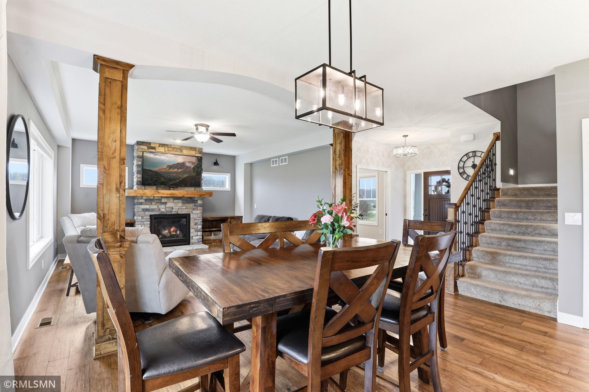Enjoy a seamless connection between the dining and living areas, perfect for hosting and everyday living. Gather around the table, then relax by the fireplace, all within an open and inviting layout filled with natural light.