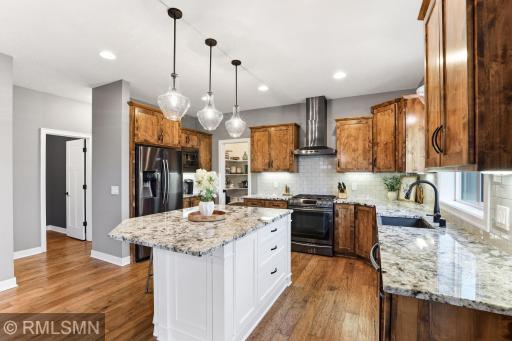 Start your day at the oversized island with space for seating, meal prep, or casual dining. Enjoy modern appliances and a layout designed for both functionality and everyday comfort.