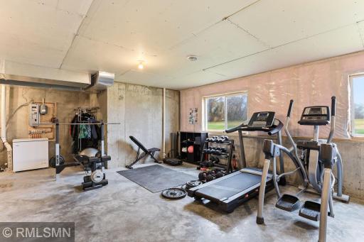 Set up your ideal home gym or recreation space in this spacious basement, featuring daylight windows that bring in natural light and make the lower level feel open and inviting.