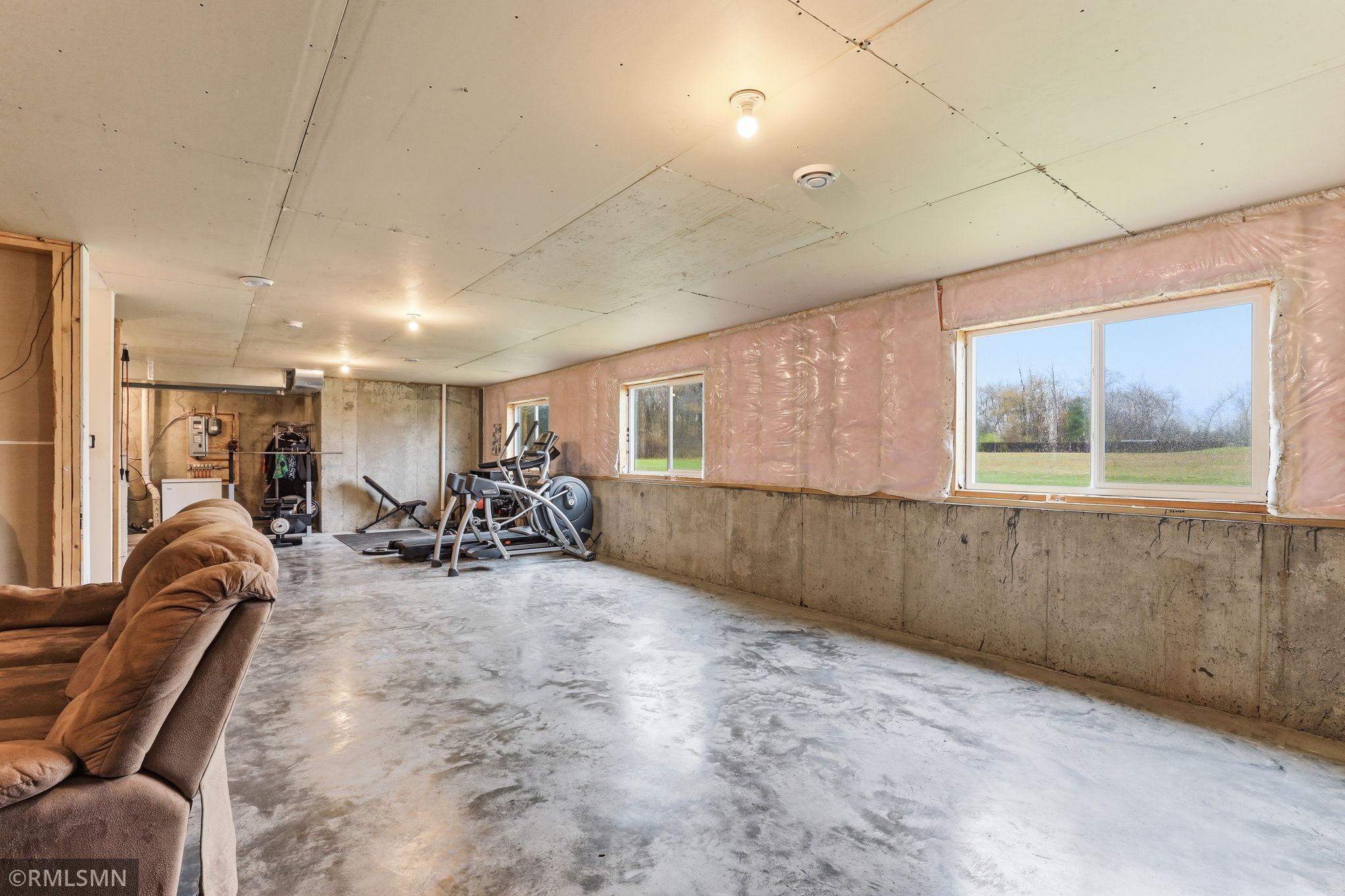 Set up a home gym, hobby zone, or play space with plenty of room to move, plus natural light from multiple windows.