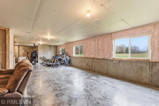Set up a home gym, hobby zone, or play space with plenty of room to move, plus natural light from multiple windows.