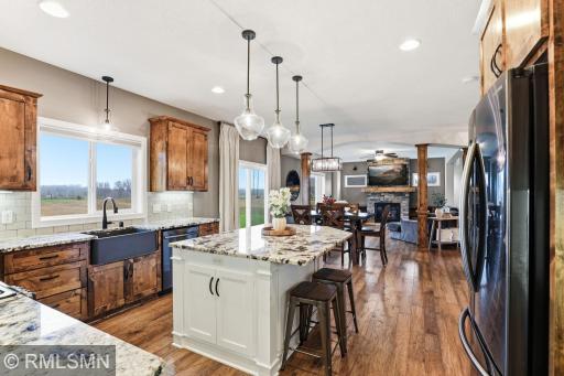 Entertain effortlessly with a layout that flows from kitchen to dining to living space. Host gatherings, keep conversations going, and enjoy the warmth of the fireplace just steps away.