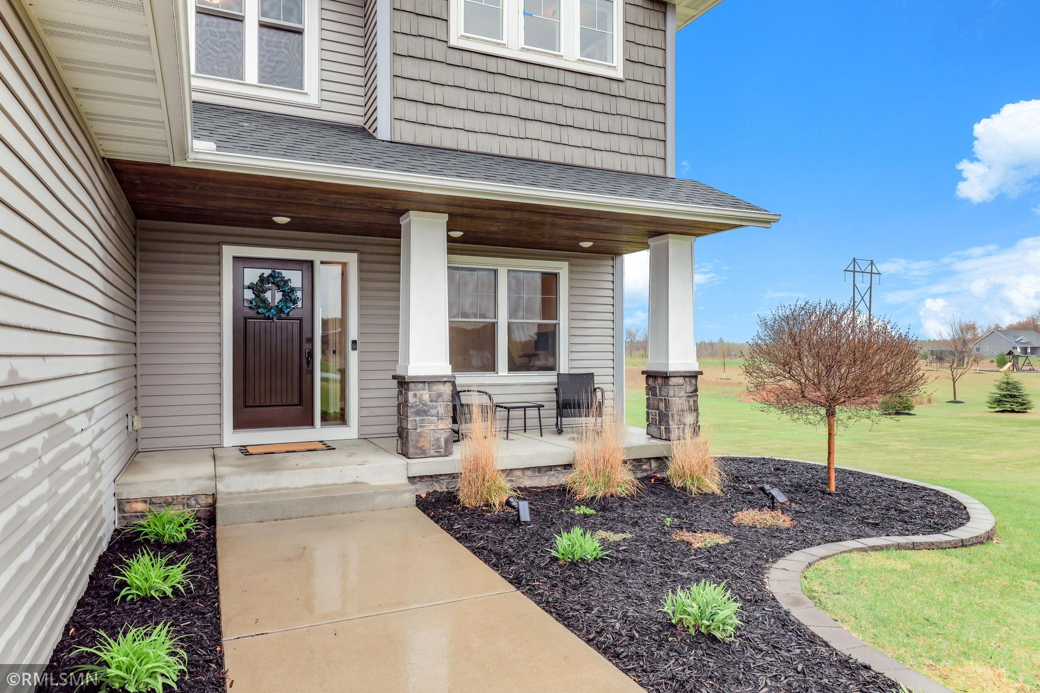 Inviting front porch perfect for relaxing and enjoying the peaceful surroundings. Sit back and unwind with your morning coffee or evening sunset.