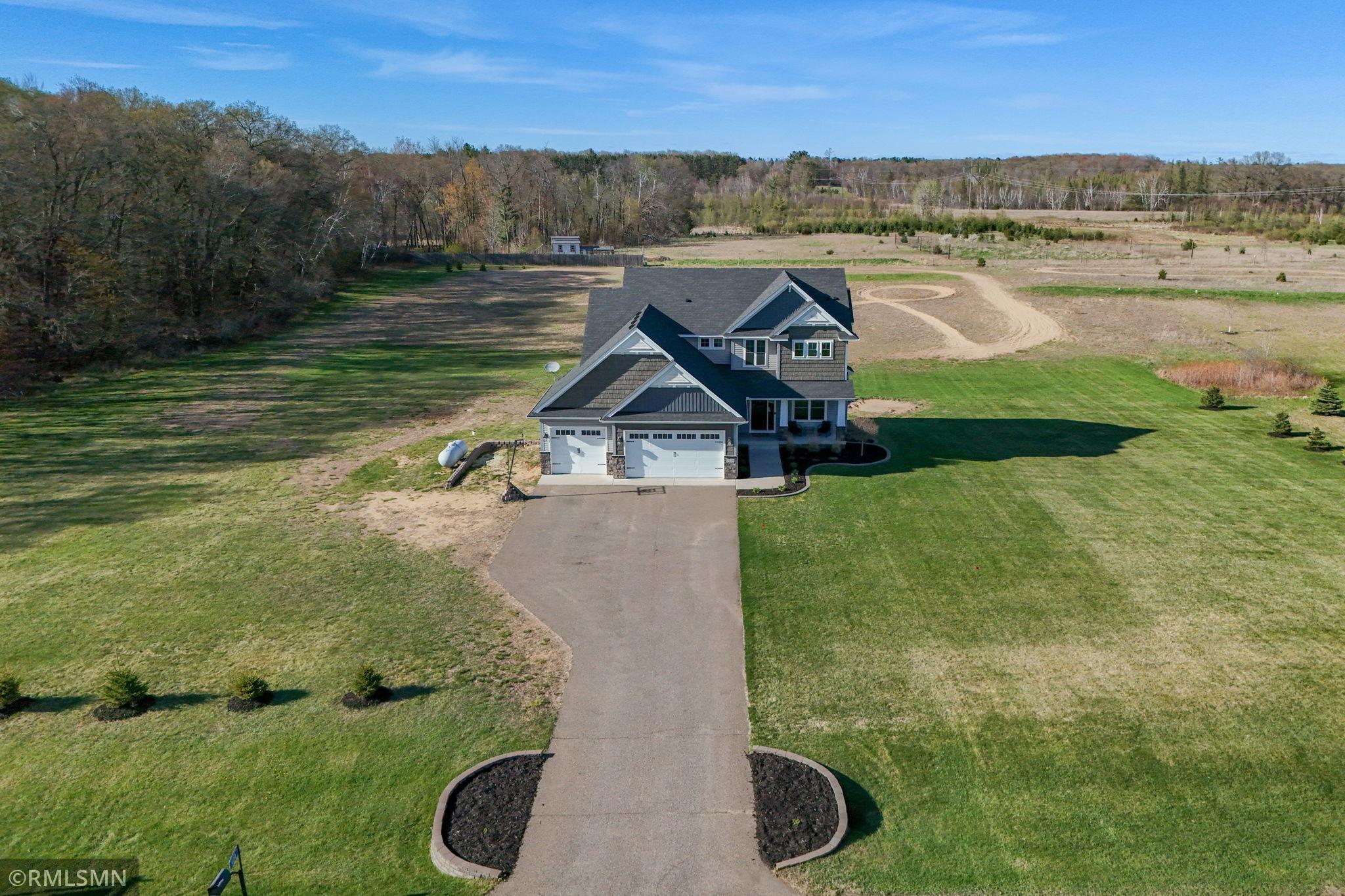 Welcome home to a beautifully designed exterior with a 3 car garage, inviting front porch, and spacious driveway, all set on a private 3 acre lot with room to enjoy the outdoors!