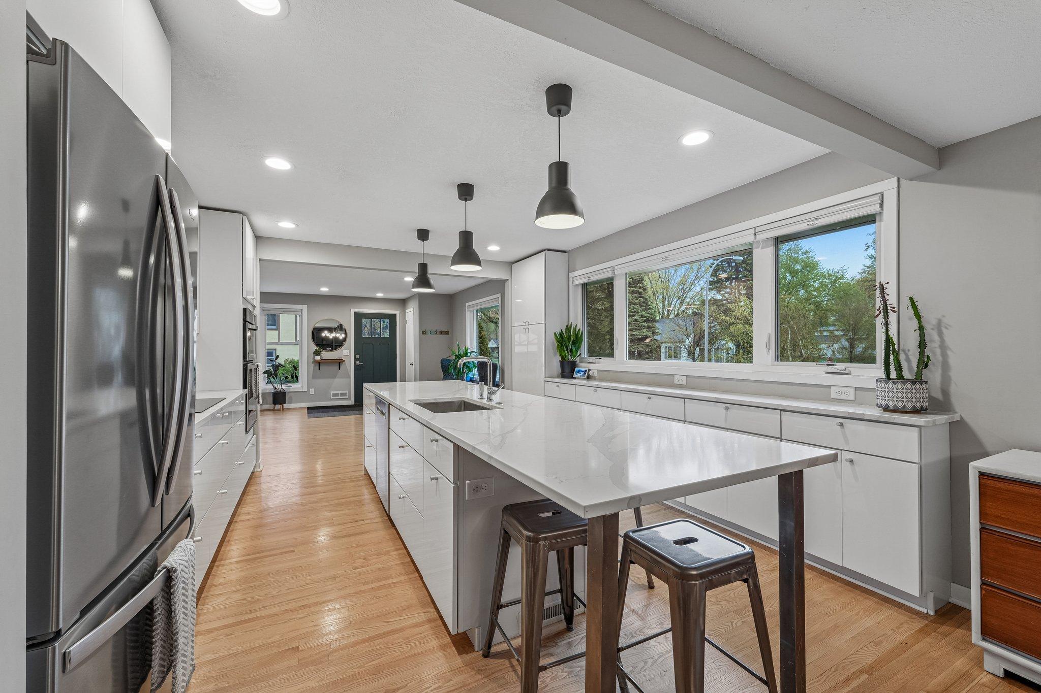Gather around the expansive kitchen island — perfect centerpiece for entertaining, dining, and everyday living.