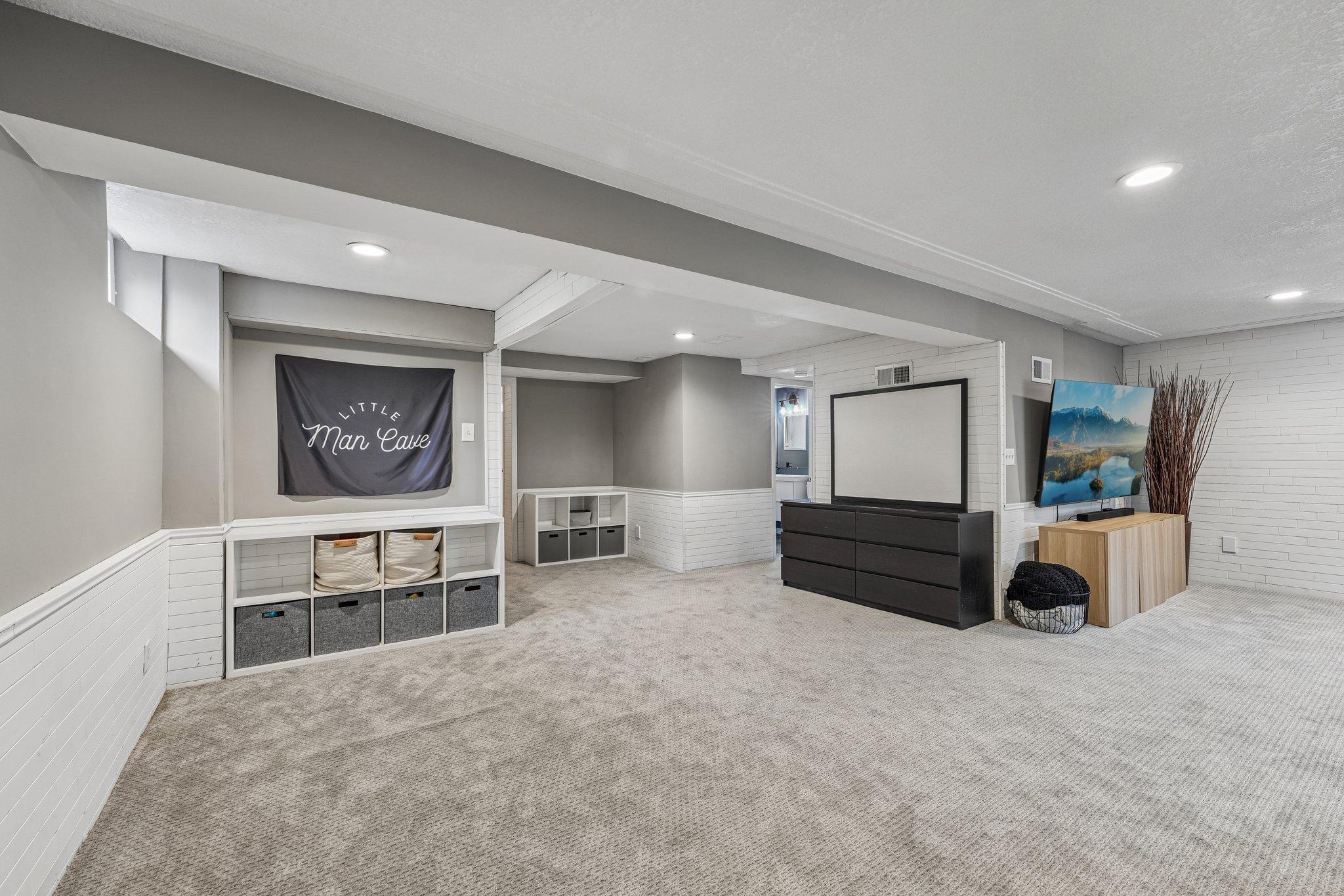 The expansive lower-level family room offers plenty of space to relax, entertain, or create the ultimate recreation area.