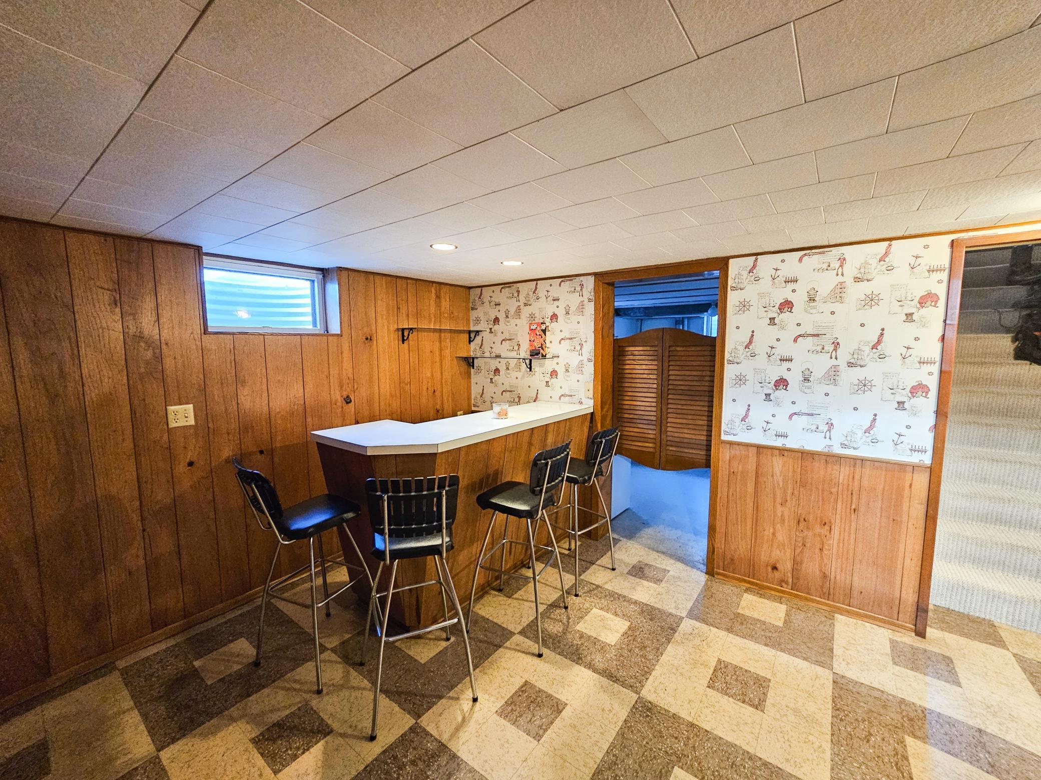 The mid-century paneling and specific flooring preserve the authentic retro charm.