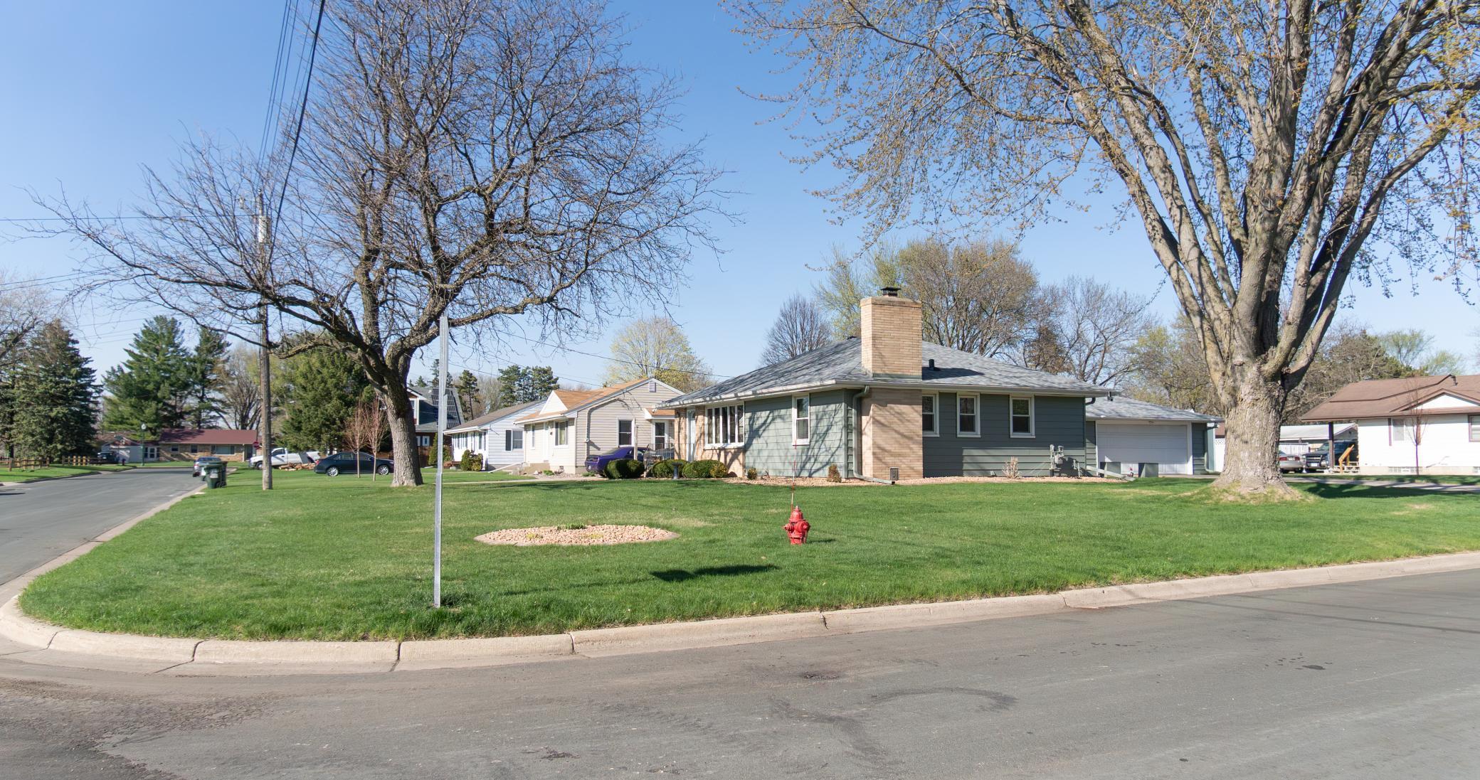 This corner lot property offers increased natural light, mature trees, spacious yard