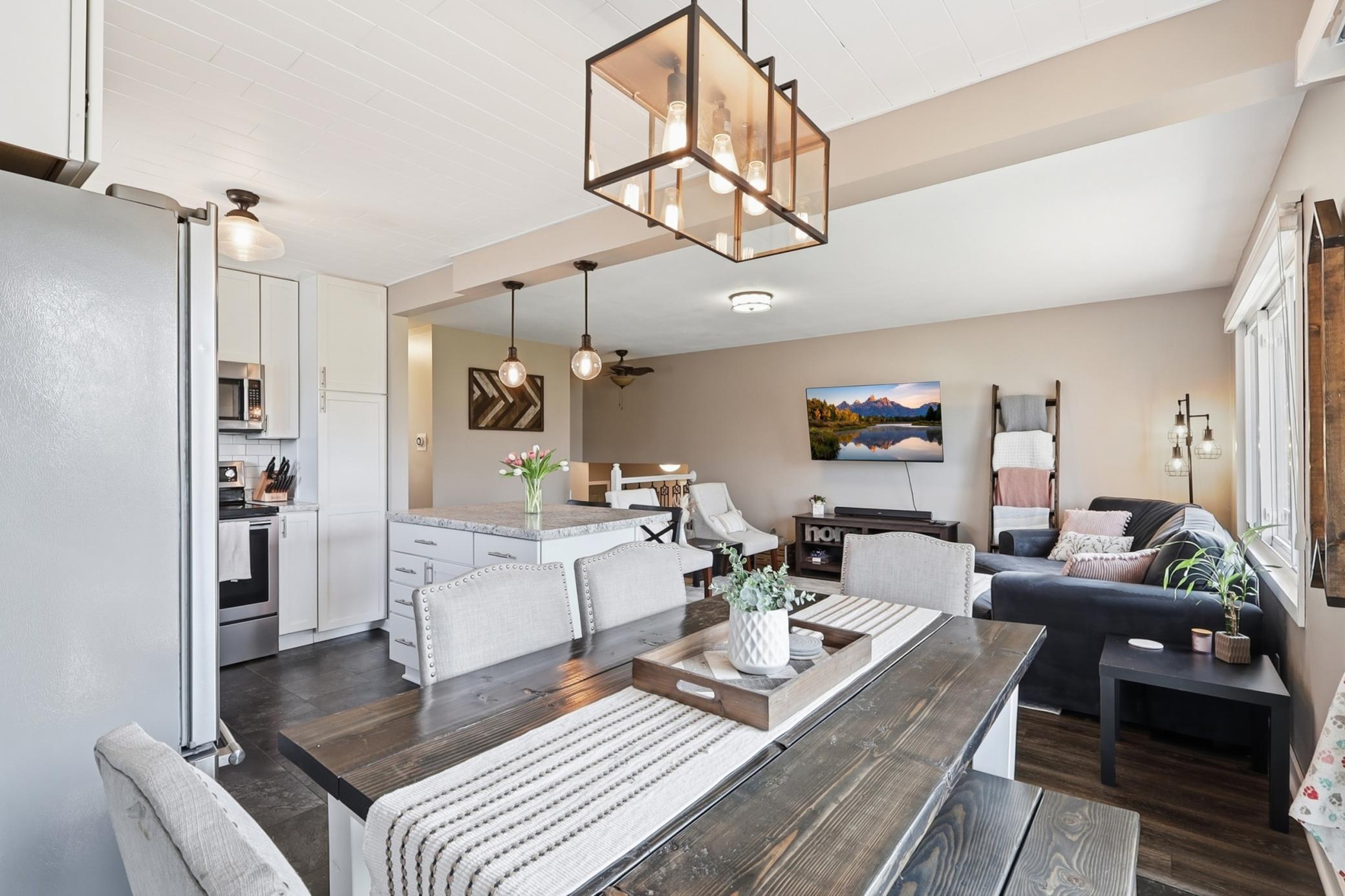Dining room, kitchen island and living room view