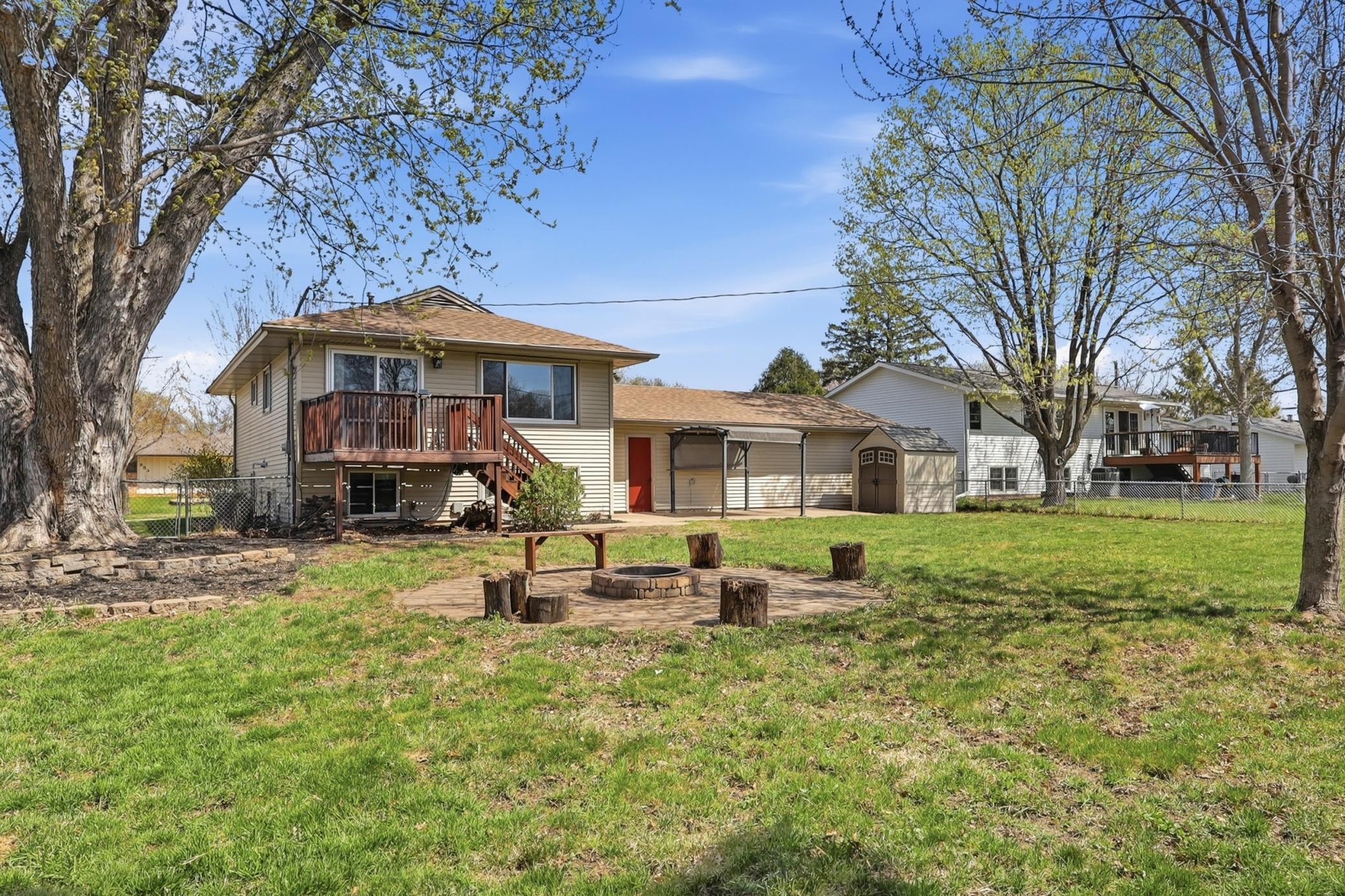 Back yard facing the house over the fire pit