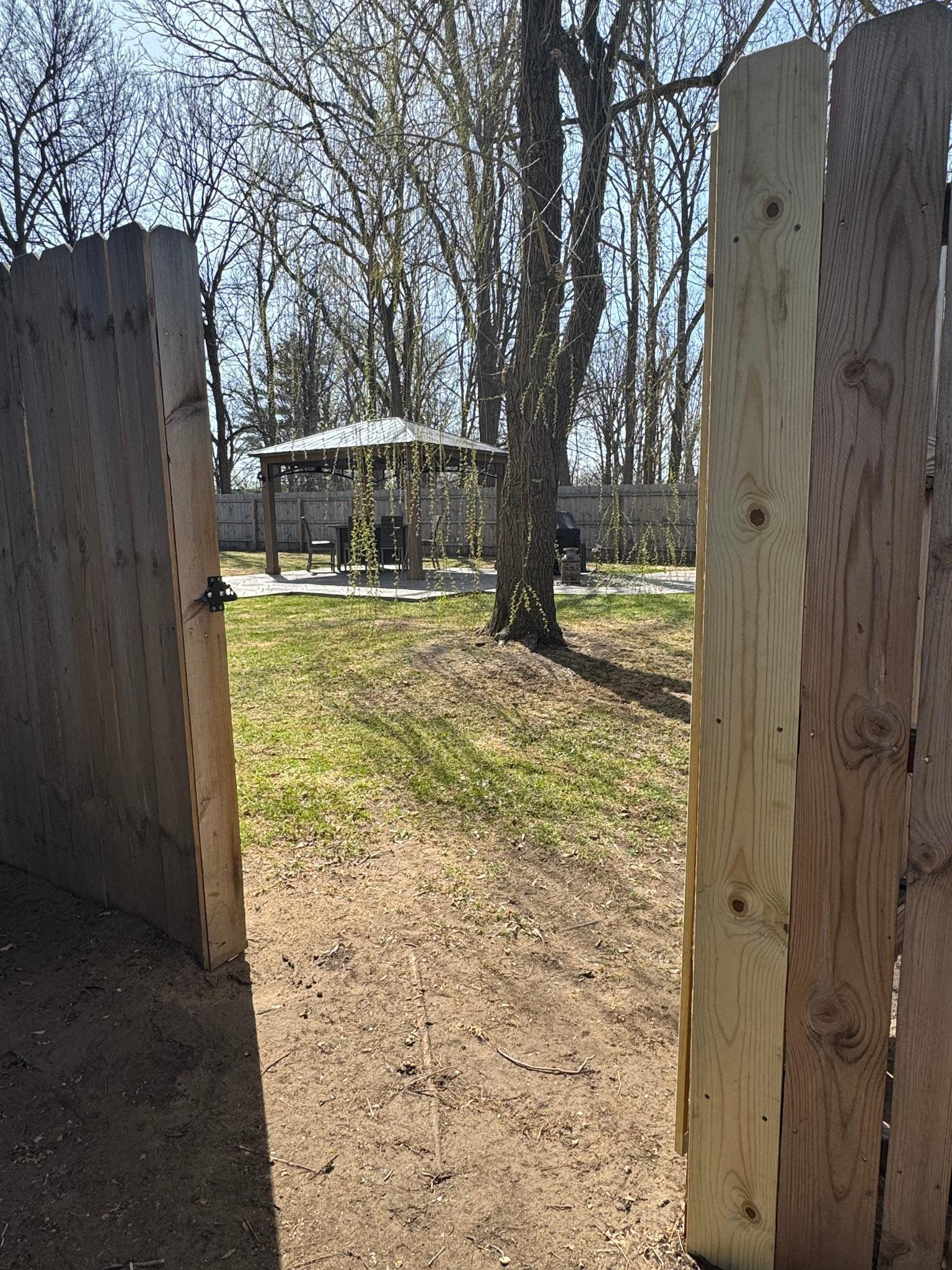 Privacy! Privacy! and exterior entrance to your backyard oasis.