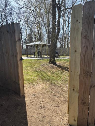 Privacy! Privacy! and exterior entrance to your backyard oasis.