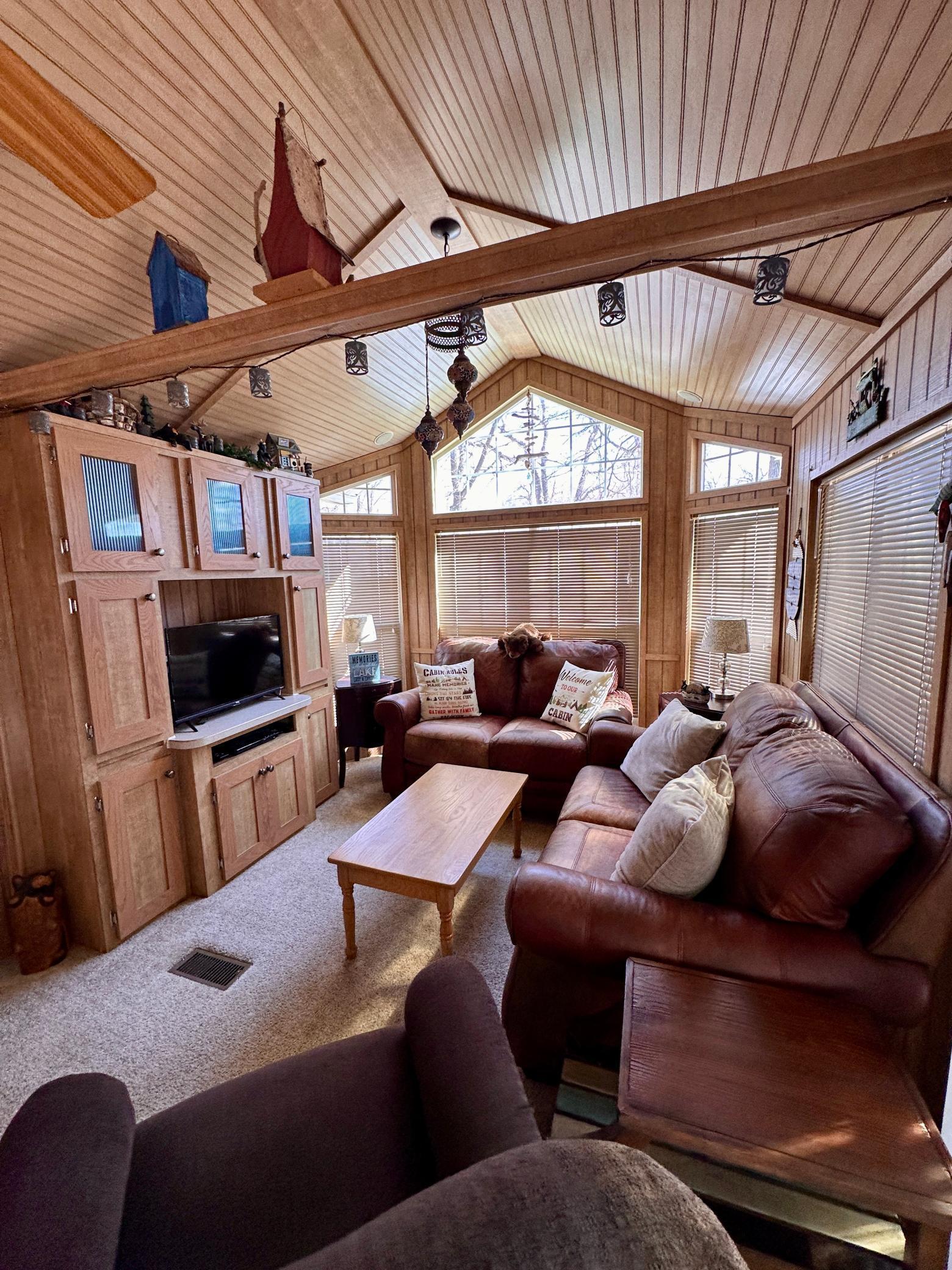 Nice sized living room with tall ceilings and lots of storage!