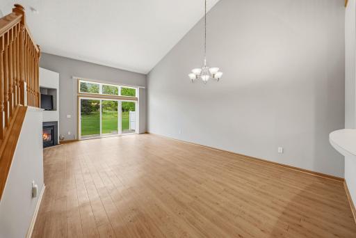 Dining and living room with sliding door to patio.