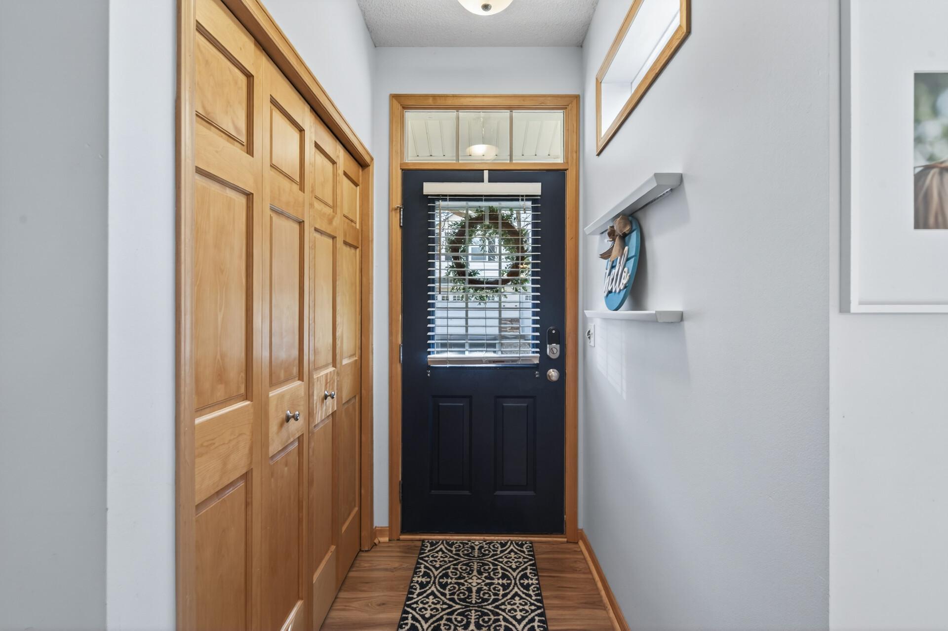 Enter into the spacious foyer equipped with an oversized coat closet.