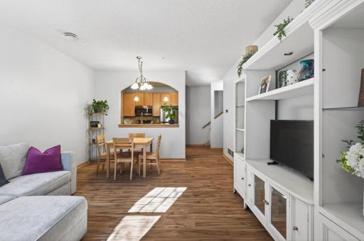 The sunny living room flows effortlessly into the dining area and kitchen - perfect for entertaining!