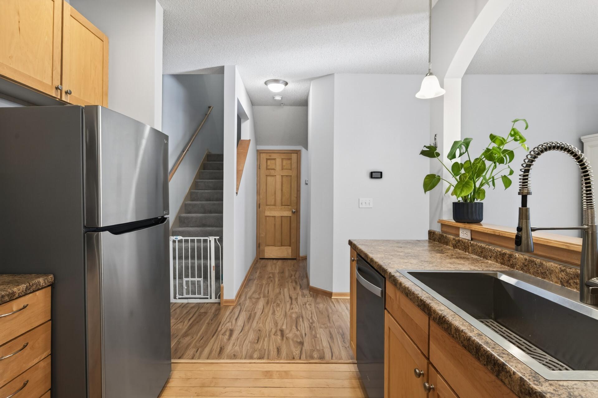 Down the hall you will find a half bathroom and the attached garage!