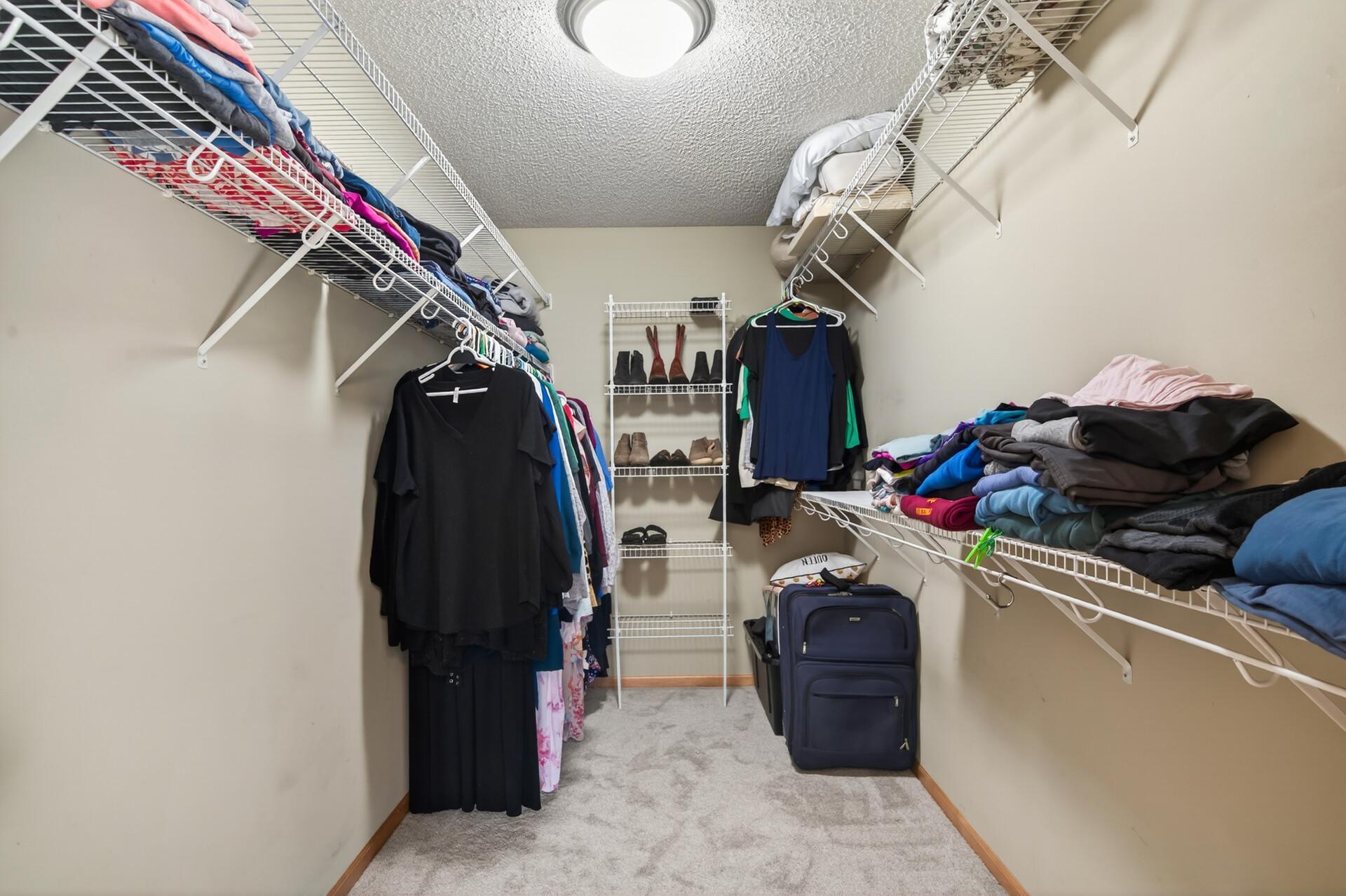 Primary bedroom walk-in closet.