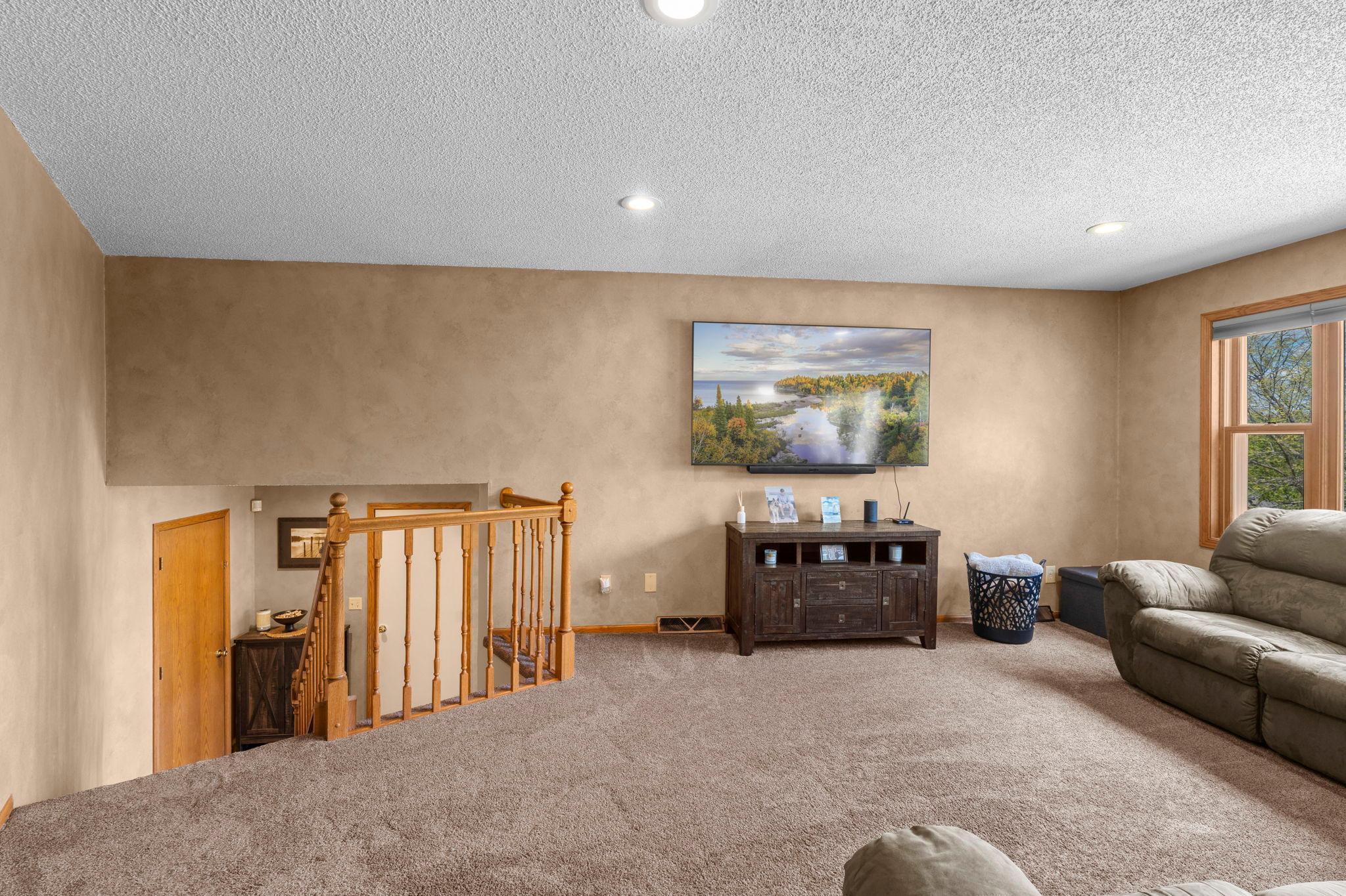 Open stairwell leads to living room