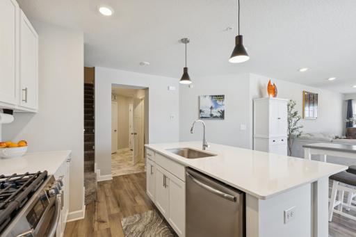 Kitchen opens to dining room and living room