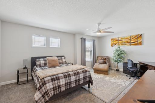 Primary bedroom is a true retreat with large closet, private bathroom, and beautiful sitting area