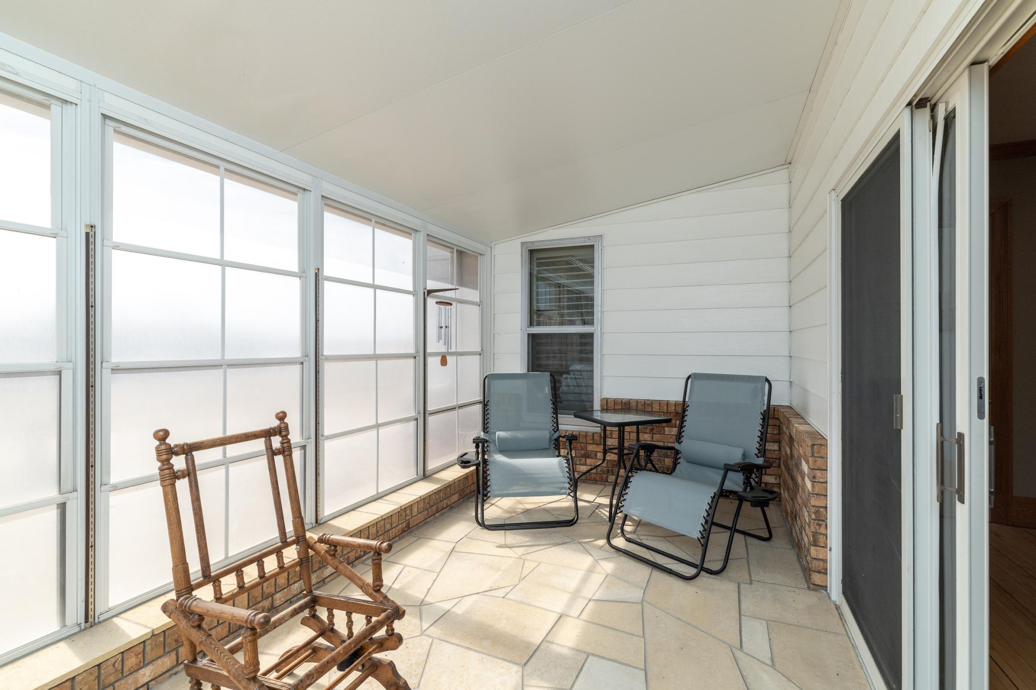 18 x 9 enclosed porch with flagstone floor and southern exposure for all day sun