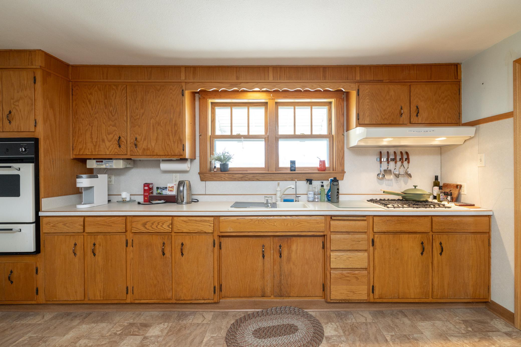 Oak cabinetry and south facing window for lots of natural light