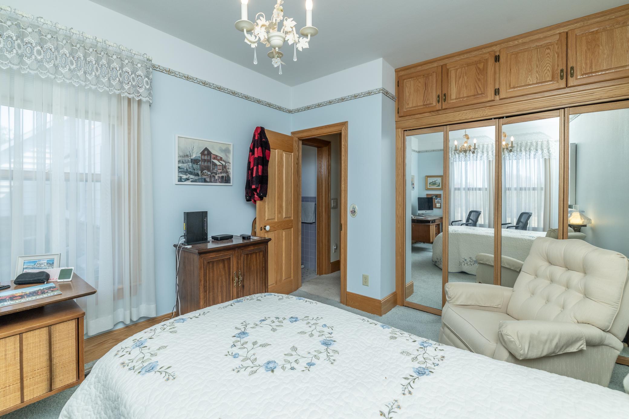 Main floor bedroom with good size closet and overhead storage