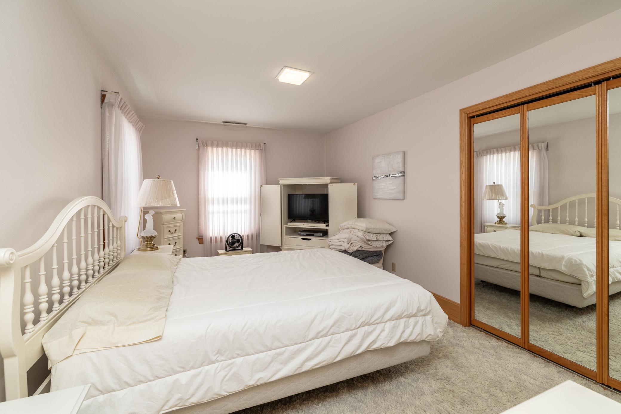 One of four upper level bedrooms