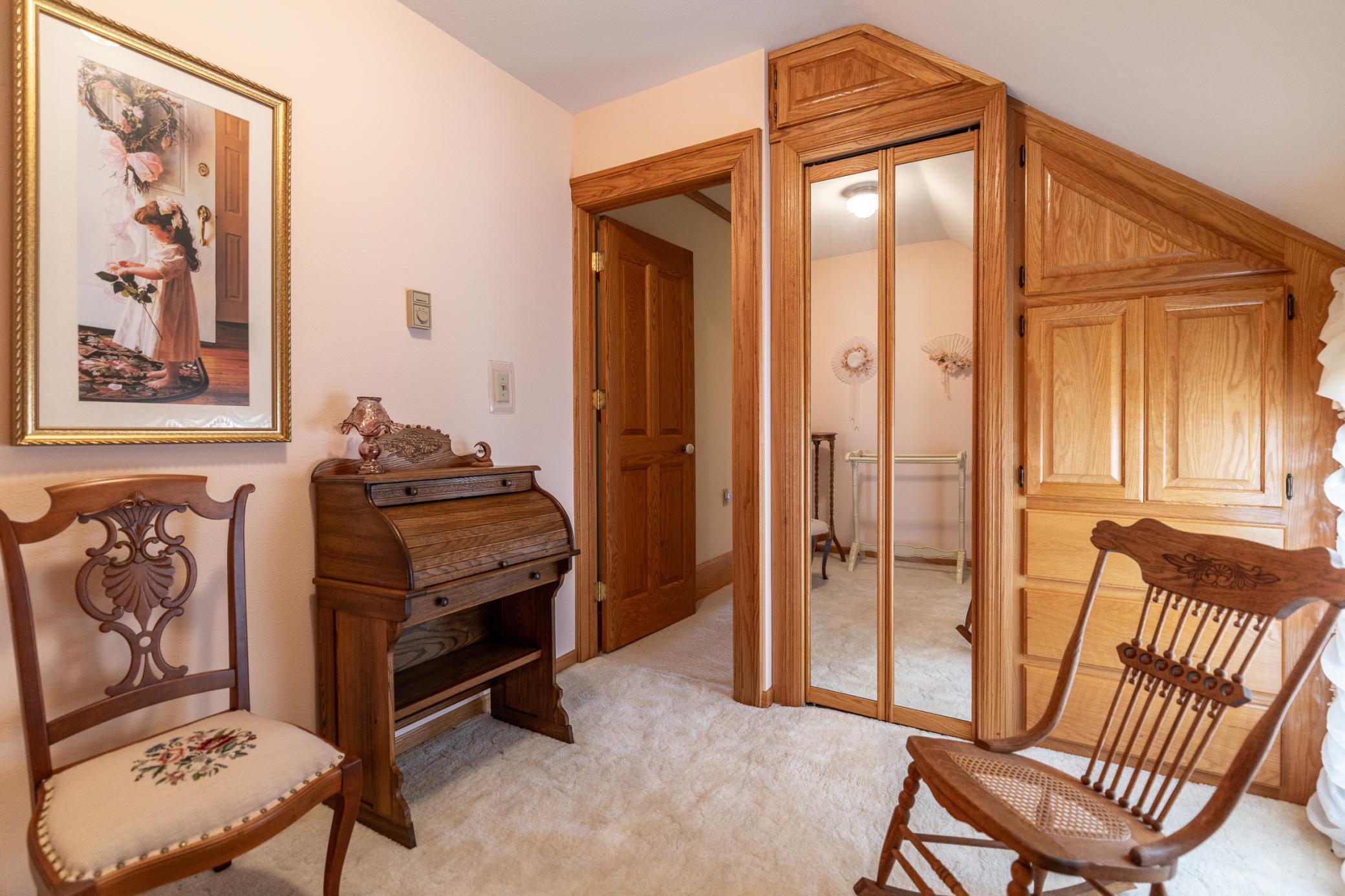 Cozy upper level sitting room would be perfect for a nursery or office