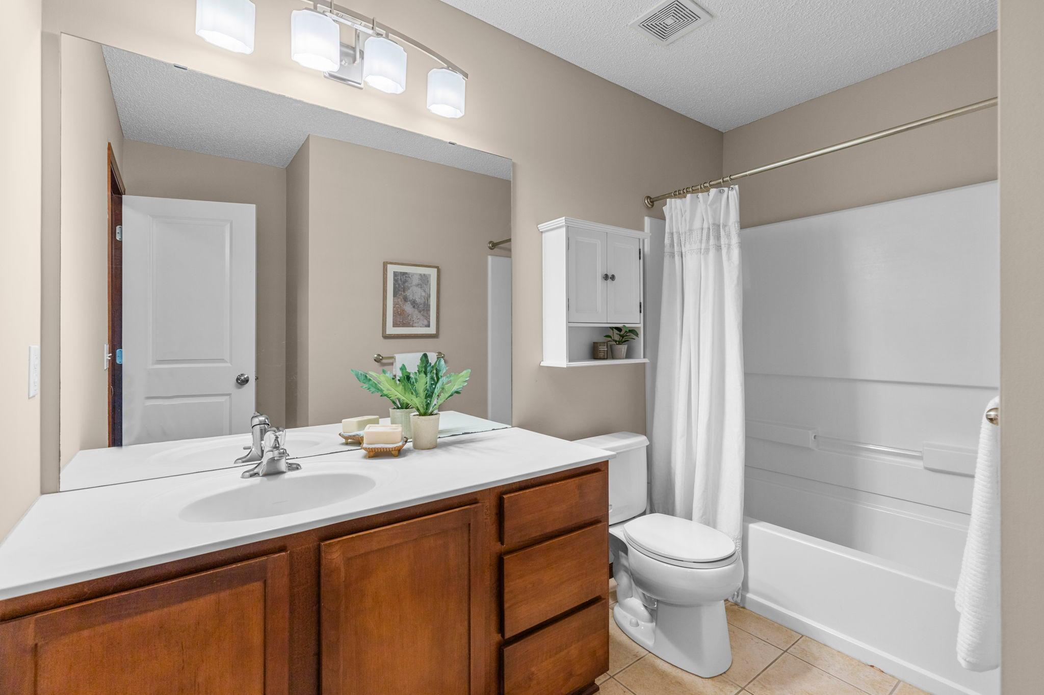 Full bath upper level next to 2nd bedroom
