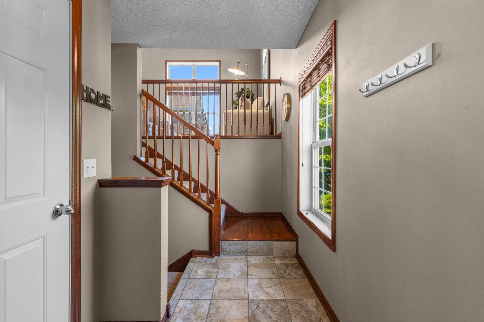 Not your typical multi-level split townhouse - spacious entry, closet and direct access to the garage